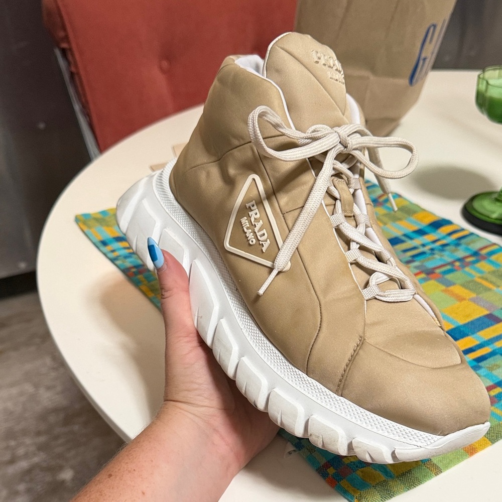 Prada Beige High-Top Sneakers with White Sole and Logo Triangle